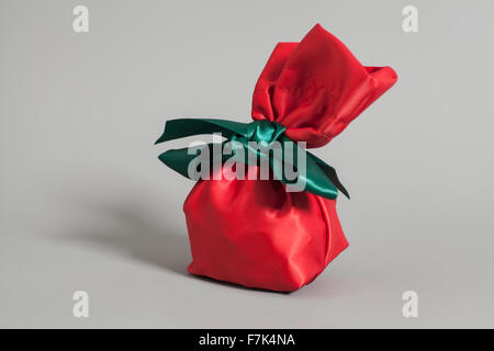 Red Gift Sack isolated on gray background Stock Photo