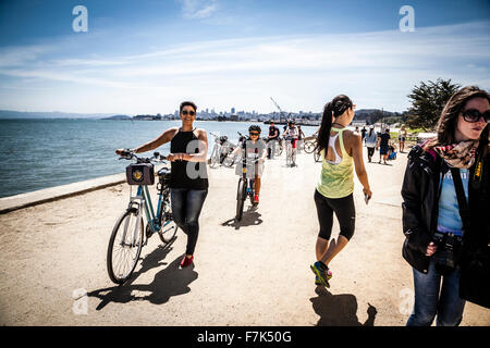 people cycling in the Presidio near the Golden Gate Bridge in San Francisco Stock Photo