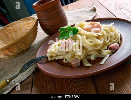 Fettuccine alla papalina - pasta with prosciutto,parmesan,butter Stock Photo