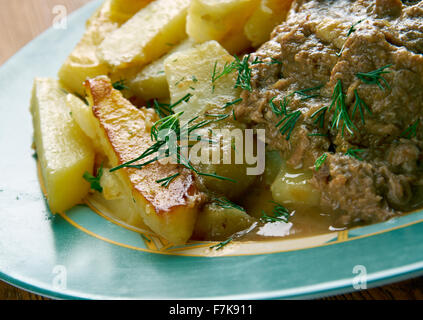 Stoofvlees - Dutch Stoverij, traditional Belgian and French Flemish sweet-sour beef and onion stew . Stock Photo