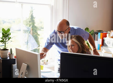 Business people working at computer in home office Stock Photo