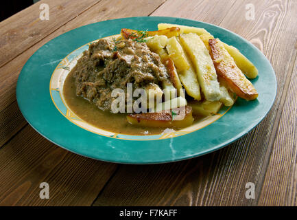 Stoofvlees - Dutch Stoverij, traditional Belgian and French Flemish sweet-sour beef and onion stew . Stock Photo