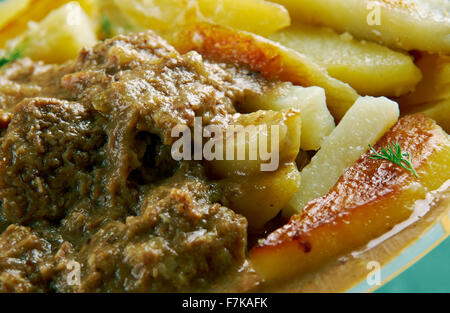 Stoofvlees - Dutch Stoverij, traditional Belgian and French Flemish sweet-sour beef and onion stew . Stock Photo