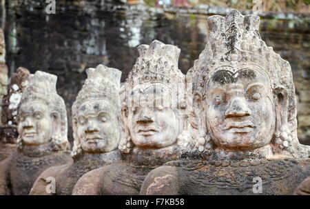 Stone faces on the bridge at the south gate of Angkor Thom, Cambodia, Asia Stock Photo