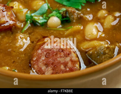 Fasole cu carnati - beans with sausages.  popular Romanian dish, consisting of baked beans and sausages. Stock Photo