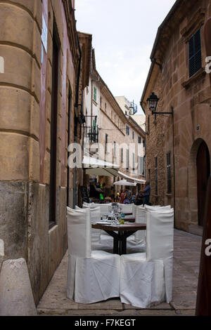 Street scene in Alducia, outside tables for dining Stock Photo
