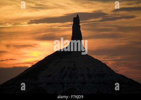 Sunset on Chimney Rock National Historic Site, Nebraska, the most famous site on the Oregon Trail for early settlers and pioneers Stock Photo