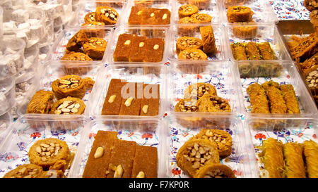 Traditional Turkish / Arabic Dessert ; Baklava Different kinds of Baklava with honey and nuts on display Stock Photo