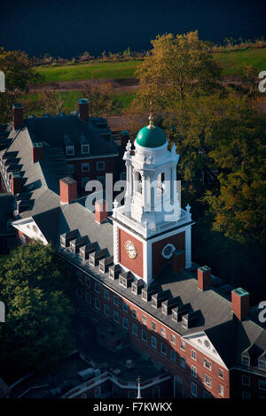 AERIAL VIEW of Harvard Campus featuring Eliot House Clock Tower along Charles River, Cambridge, Boston, MA Stock Photo