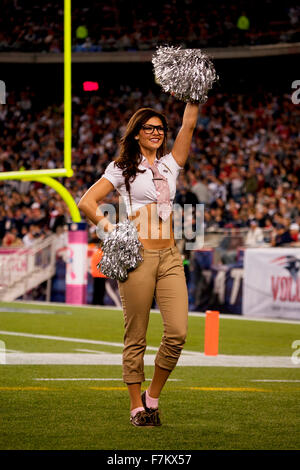 A New England Patriots cheerleaders cheer during the first half of the ...