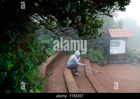 Poas, Costa Rica. 30th Nov, 2015. A tourist visits the tropical cloud forest in the Poas Volcano National Park, Alajuela province, 45km northwest of San Jose, capital of Costa Rica, on Nov. 30, 2015. The Poas Volcano National Park, founded on Jan. 25, 1971, is the oldest and most visited by tourists park in the country. © Kent Gilbert/Xinhua/Alamy Live News Stock Photo