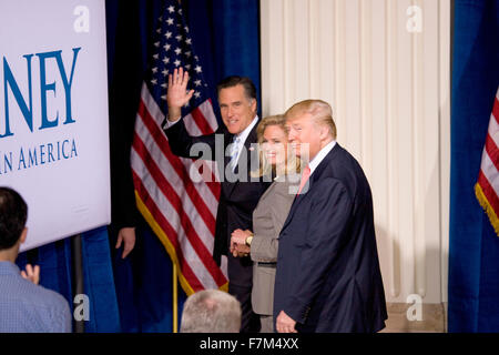 Mitt and Ann Romney and Donald Trump exit stage after Trump will endorsed Candidate Mitt Romney for President at the Trump International Hotel in Las Vegas on February 2, 2012 Stock Photo