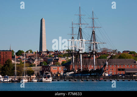 USS Constitution historic ship, Old Ironsides a Three Masted Frigit, is seen near Bunker Hill Monument on harbor,, Freedom Trail, Charlestown, Boston, MA Stock Photo