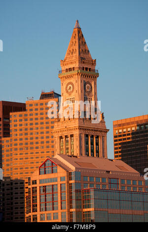 Commerce House Tower (built 1910) and Boston Skyline at sunrise as photographed from Lewis Wharf, Boston, MA Stock Photo