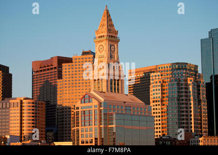 Commerce House Tower (built 1910) and Boston Skyline at sunrise as photographed from Lewis Wharf, Boston, MA Stock Photo
