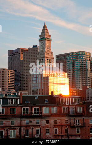 Commerce House Tower (built 1910) and Boston Skyline at sunset as photographed from Lewis Wharf, Boston, MA Stock Photo