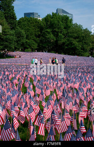 People walk through 20,000 American Flags that, are displayed for every resident of Massachusetts who died in a war over the past 100 years, Boston Common, Boston, MA, Memorial Day, 2012 Stock Photo