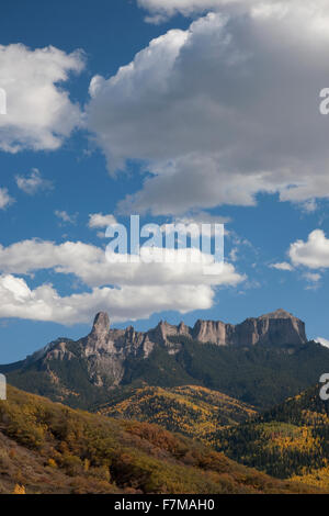 Chimney Peak with white puffy clouds showing Courthouse Mountain in the Uncompahgre National Forest, Colorado Stock Photo