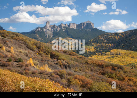 Chimney Peak with white puffy clouds showing Courthouse Mountain in the Uncompahgre National Forest, Colorado Stock Photo