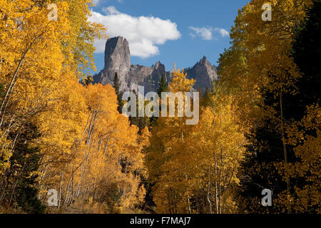 Chimney Peak with white puffy clouds showing Courthouse Mountain in the Uncompahgre National Forest, Colorado Stock Photo