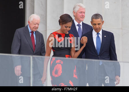 President Barack Obama, First Lady Michelle Obama and former presidents Jimmy Carter and Bill Clinton arrive for the ceremony to commemorate the 50th anniversary of the March on Washington for Jobs and Freedom August 28, 2013 in Washington, DC. Stock Photo