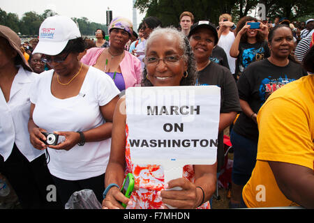 Audiences on the National Mall listen to Presidential speeches at the Let Freedom Ring ceremony at the Lincoln Memorial August 28, 2013 in Washington, DC, commemorating the 50th anniversary of Dr. Martin Luther King Jr.'s 'I Have a Dream' speech. Stock Photo