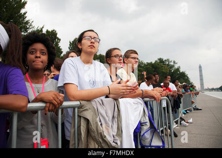 Audiences on the National Mall listen to Presidential speeches at the Let Freedom Ring ceremony at the Lincoln Memorial August 28, 2013 in Washington, DC, commemorating the 50th anniversary of Dr. Martin Luther King Jr.'s 'I Have a Dream' speech. Stock Photo