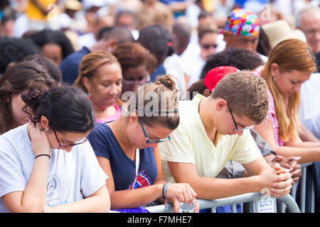 Audiences on the National Mall listen to Presidential speeches at the Let Freedom Ring ceremony at the Lincoln Memorial August 28, 2013 in Washington, DC, commemorating the 50th anniversary of Dr. Martin Luther King Jr.'s 'I Have a Dream' speech. Stock Photo