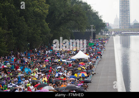 Audiences on the National Mall listen to Presidential speeches at the Let Freedom Ring ceremony at the Lincoln Memorial August 28, 2013 in Washington, DC, commemorating the 50th anniversary of Dr. Martin Luther King Jr.'s 'I Have a Dream' speech. Stock Photo