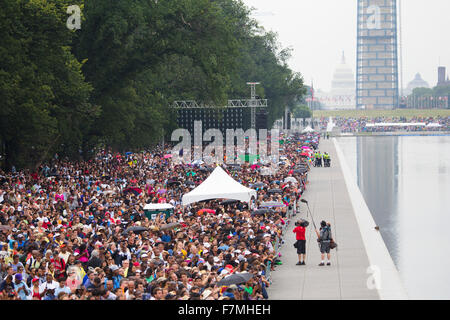 Audiences on the National Mall listen to Presidential speeches at the Let Freedom Ring ceremony at the Lincoln Memorial August 28, 2013 in Washington, DC, commemorating the 50th anniversary of Dr. Martin Luther King Jr.'s 'I Have a Dream' speech. Stock Photo