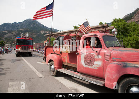 Antique Ridgway firetruck drives drives in July 4 Independence Day Parade, Ouray, Colorado Stock Photo