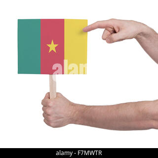 Hand holding small card, isolated on white - Flag of Cameroon Stock Photo