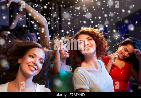 smiling friends at concert in club Stock Photo - Alamy