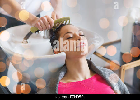 happy young woman at hair salon Stock Photo