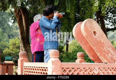 Two men capturing Taj near ancient Well Stock Photo