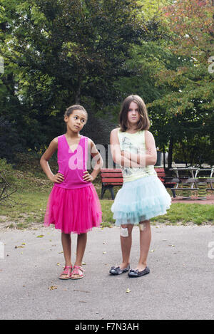 Girls dressed in tutus with tough expression on faces Stock Photo