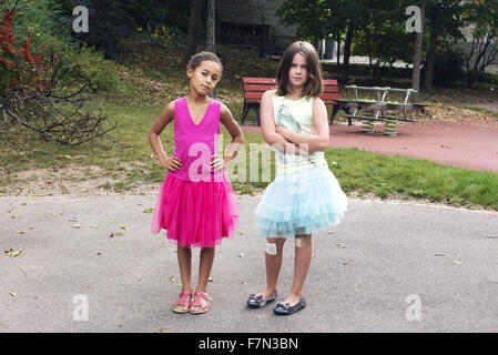 Girls dressed in tutus with tough expression on faces Stock Photo
