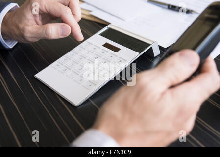Businessman concerned about corporate finances making phone call Stock Photo