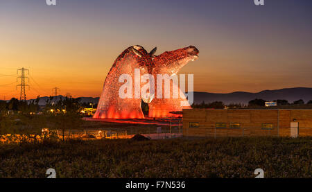 The Kelpies Horse statue lit up at night at The Helix Park in Falkirk, Scotland Stock Photo