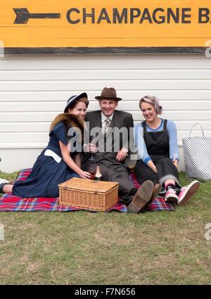 Visitors in vintage 1940's dress at the Goodwood Revival 2015 Stock Photo