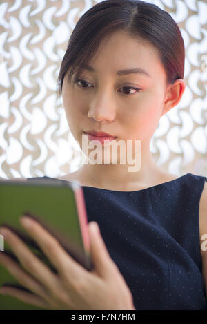 Young woman using digital tablet Stock Photo