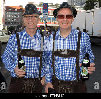Oktoberfest in Munich,Baveria,Germany. Two Tourists in Lederhosen, Stock Photo