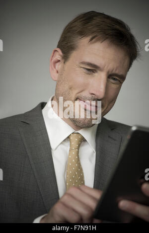 Businessman using digital tablet Stock Photo