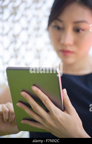 Woman using digital tablet Stock Photo