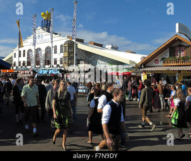 Munich Oktoberfest in Germany  Volksfest beer festival and travelling funfair with crowds Stock Photo