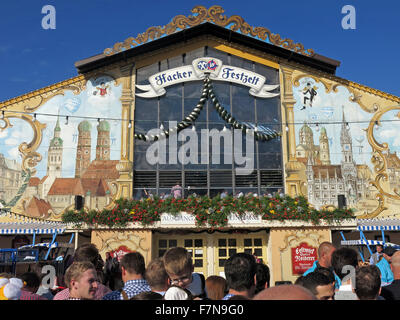 Munich Oktoberfest in Germany  Volksfest beer festival and travelling funfair, Hacker-Festzelt with people Stock Photo