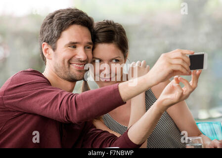 Couple taking selfie with smartphone