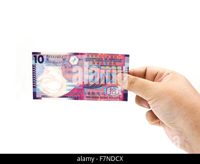10 Hong Kong dollar in hand isolated on white background. Stock Photo