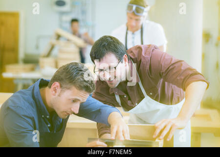 Carpenters working in workshop Stock Photo