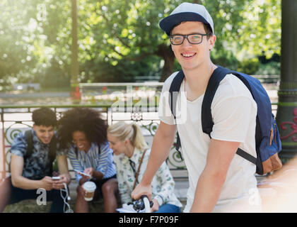 Portrait smiling man with eyeglasses in park Stock Photo